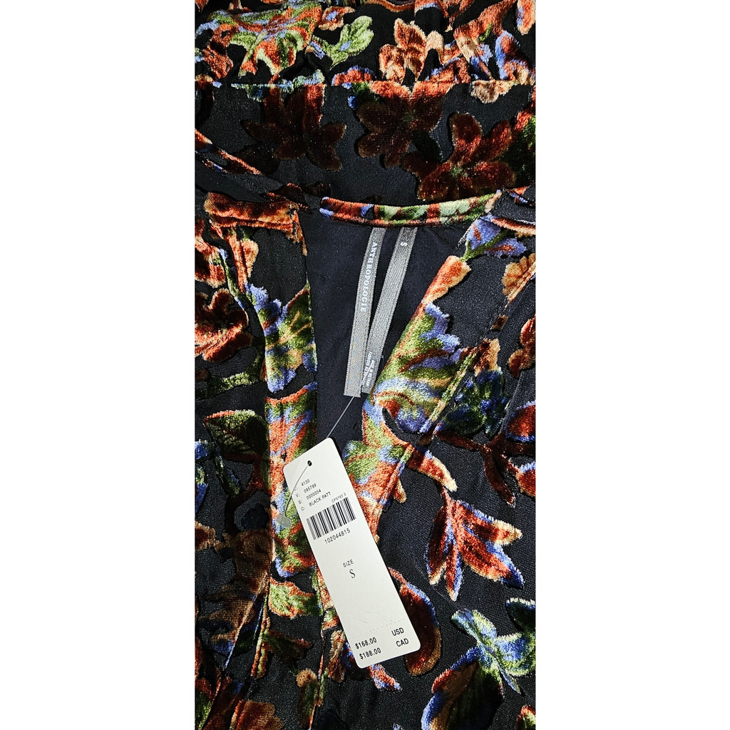 Black floral burnout velvet dress close-up with attached size and care labels