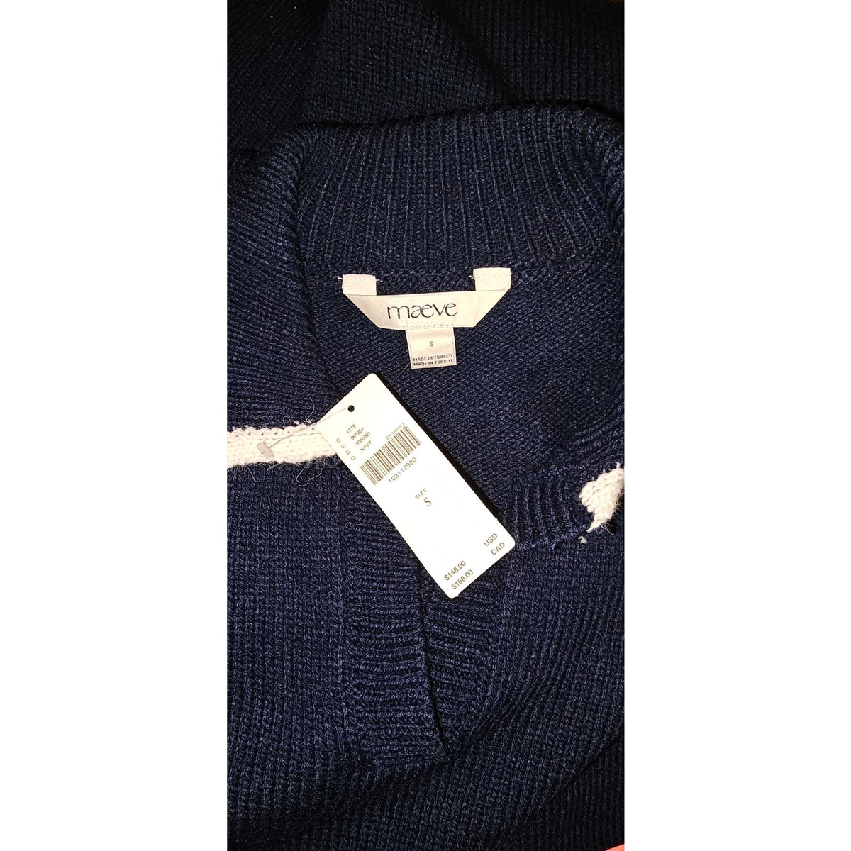 Navy knit dress close-up of ribbed collar, white trim, and Maeve label