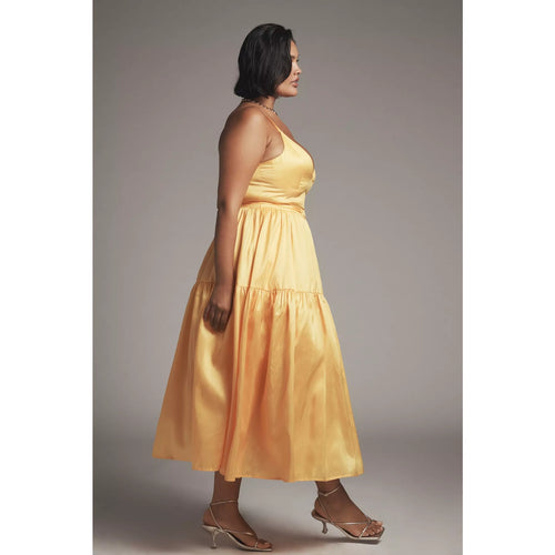 Yellow sleeveless V-neck belted midi dress, side view, tiered skirt