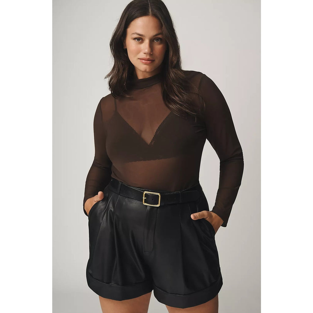 Black faux leather shorts with belt loops, side pockets, and pleated front