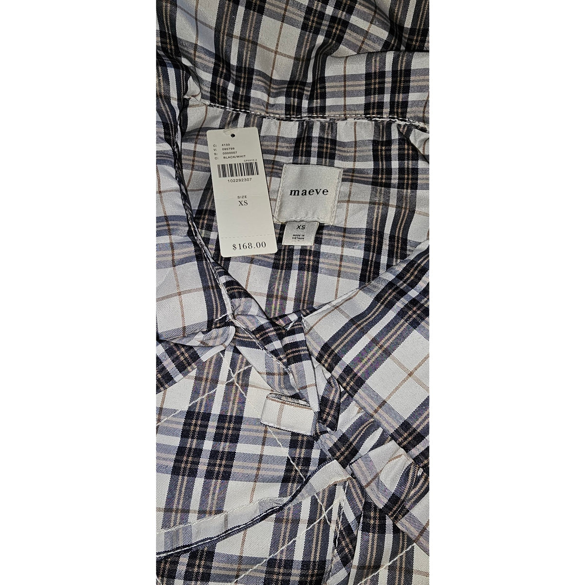 Plaid jacket interior with Maeve label and size XS tag
