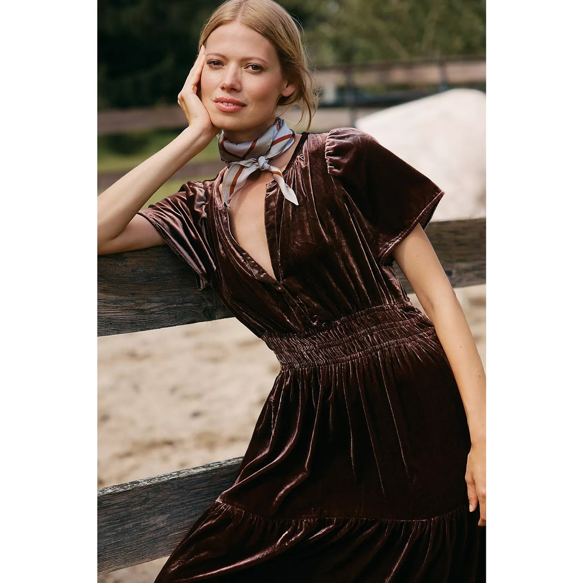Velvet maxi dress in chocolate brown with V-neckline, short sleeves, and smocked bodice
