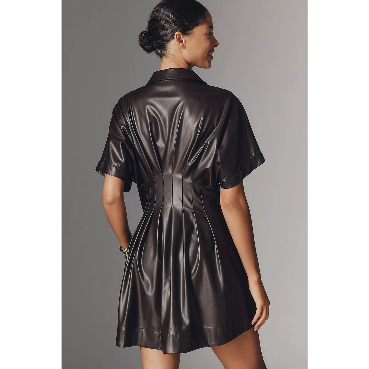 Faux leather mini shirt dress, back view with short sleeves and gathered waist seam