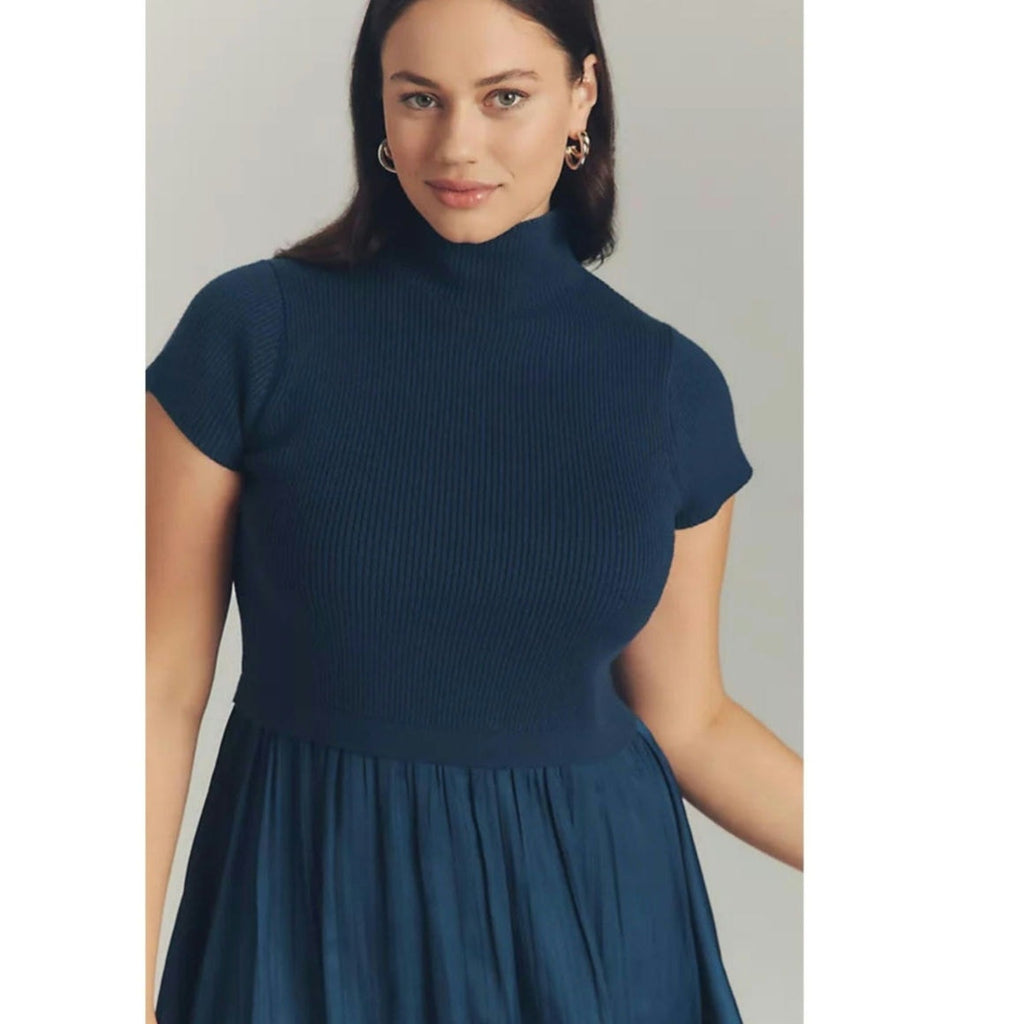 Dark navy short-sleeve sweater mini dress with high neck and pleated skirt hem