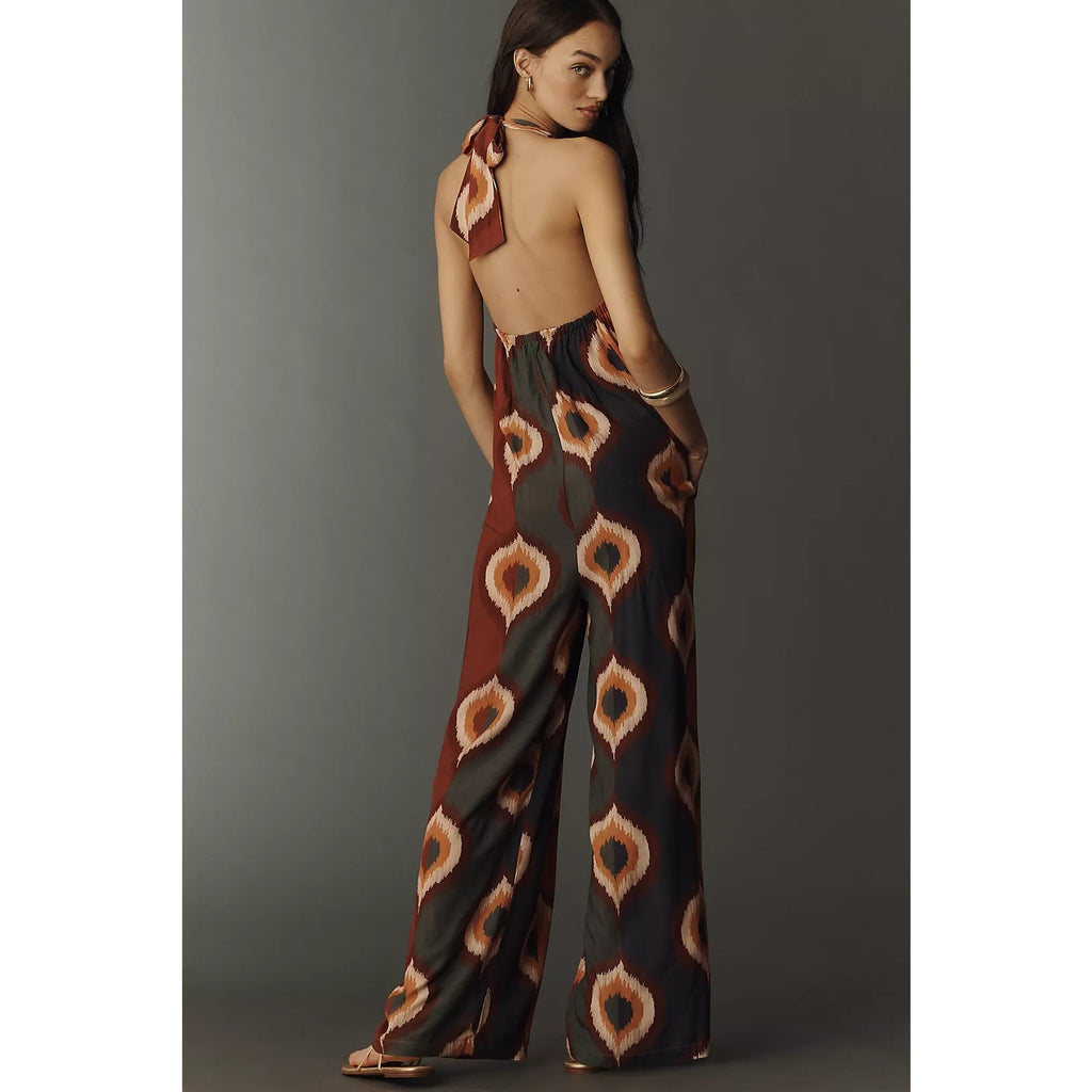 Backless halter jumpsuit with wide legs and orange-brown diamond pattern