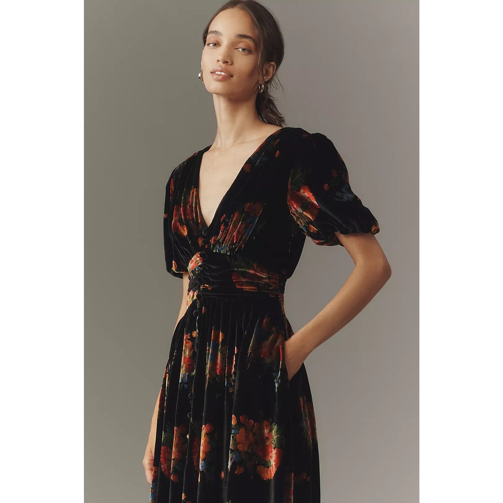 Black velvet button-front midi dress with puff sleeves and orange red abstract print