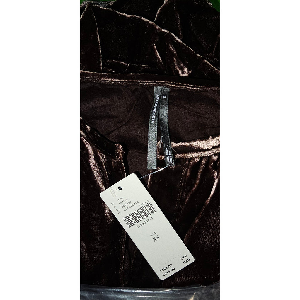 Chocolate velvet maxi dress fabric close-up with size tag attached