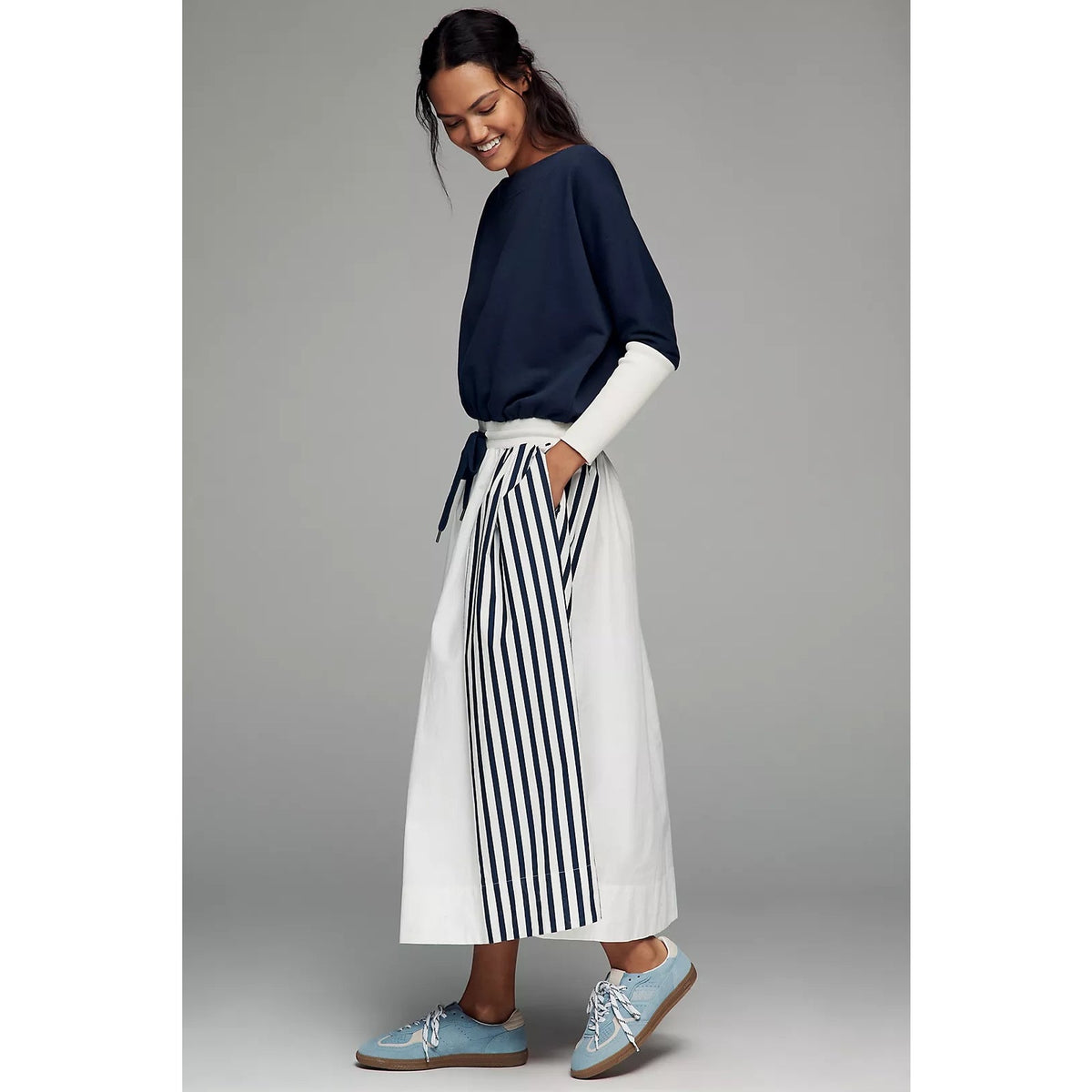 Maxi dress with navy long sleeves and white tiered skirt with navy striped panels