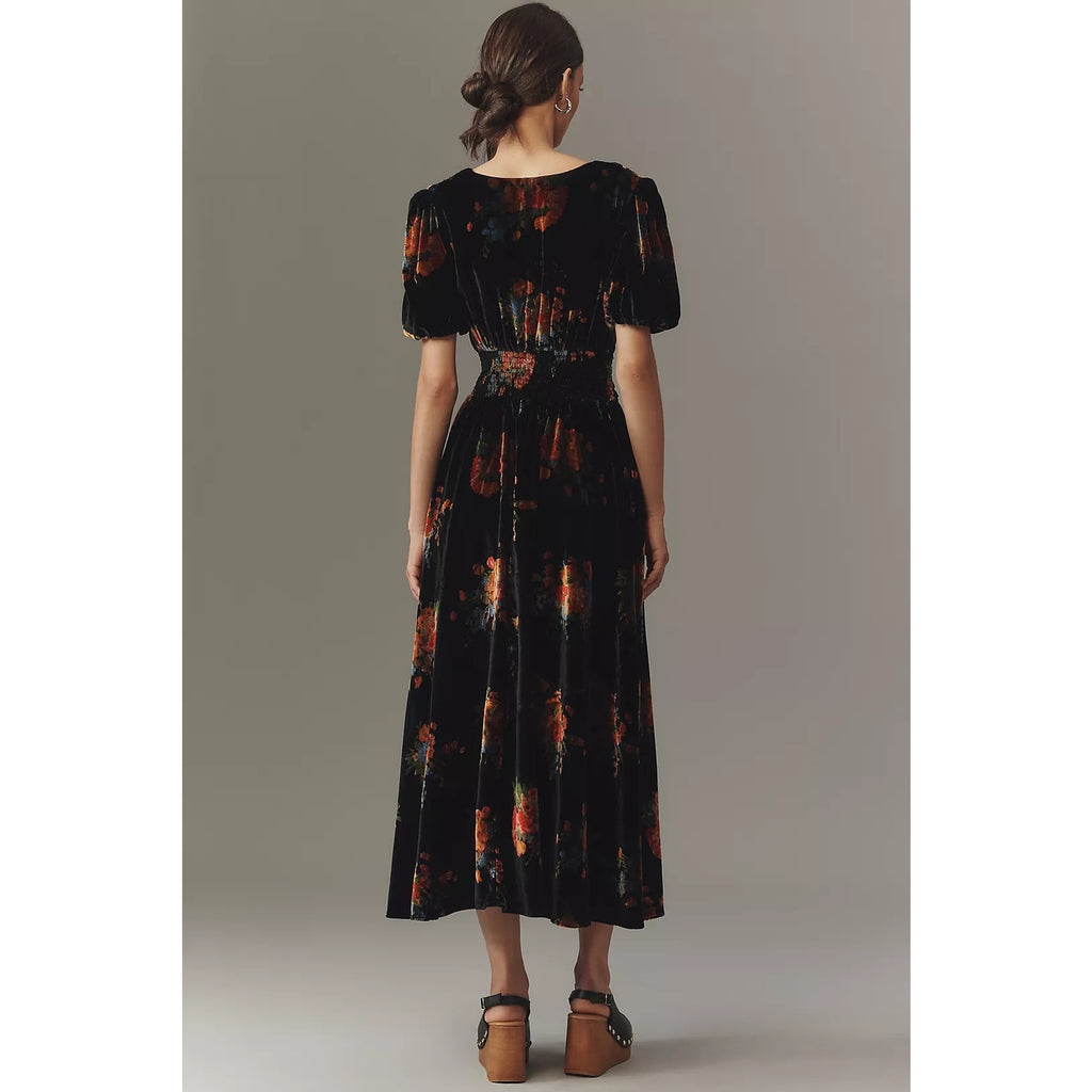 Black velvet button-front midi dress, back view with short puff sleeves
