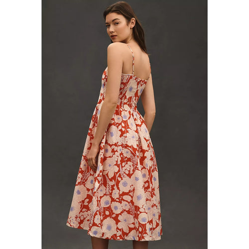 Back of red floral sleeveless midi dress with thin straps and drop-waist tiered skirt