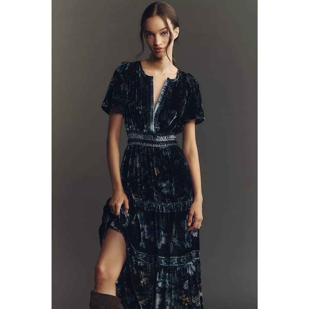 Dark blue velvet maxi dress with V-neck, short sleeves, and tiered skirt details