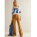 Mustard cord flare jeans with mid-rise waist and straight-to-flare legs