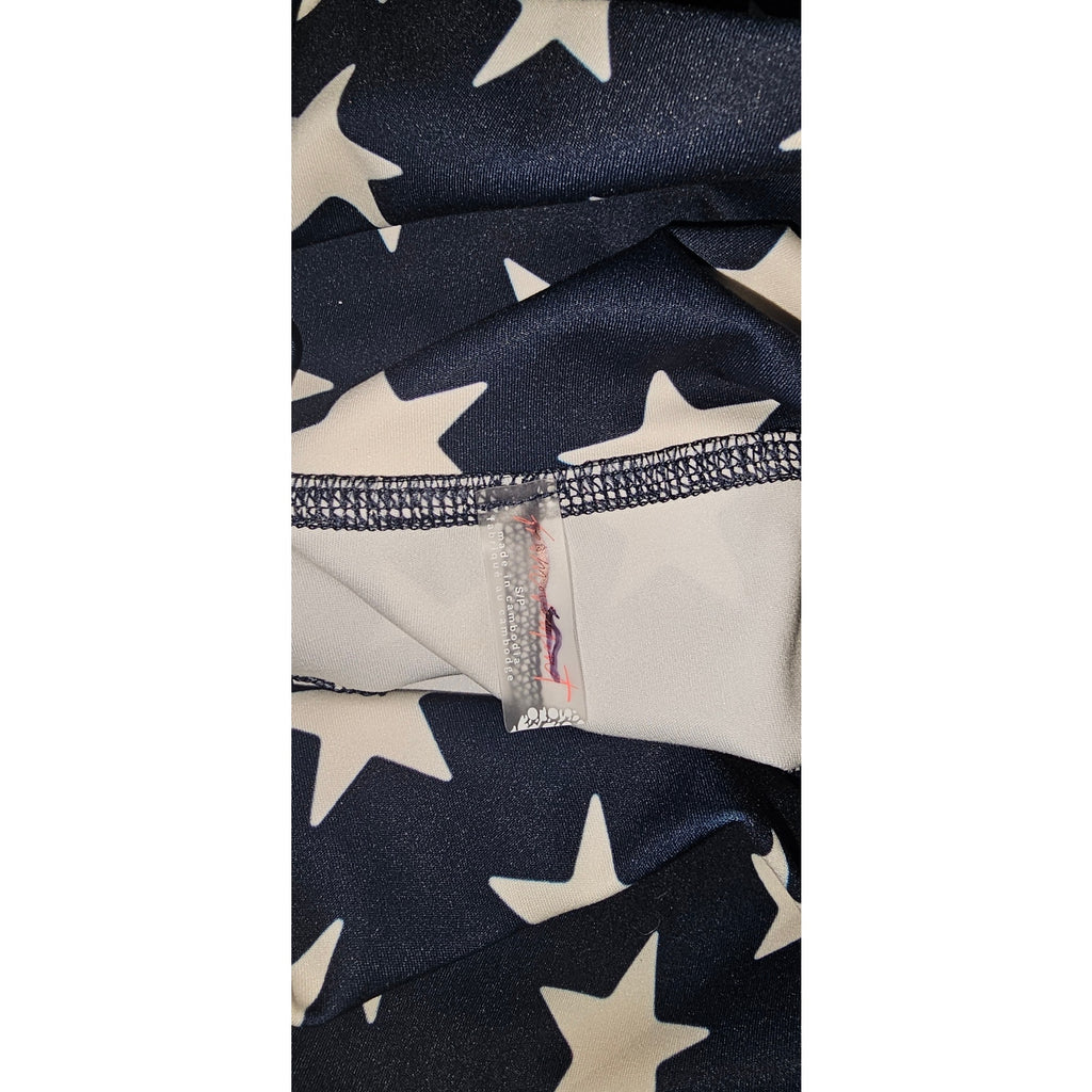 Star-printed shorts with navy base and white stars, elastic waistband detail