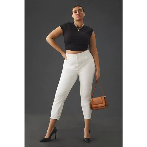 Crisp white high-rise skinny jeans, ankle-crop fit with belt loops and button fly