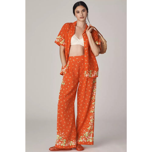 Orange high-rise wide-leg pants with allover small floral print