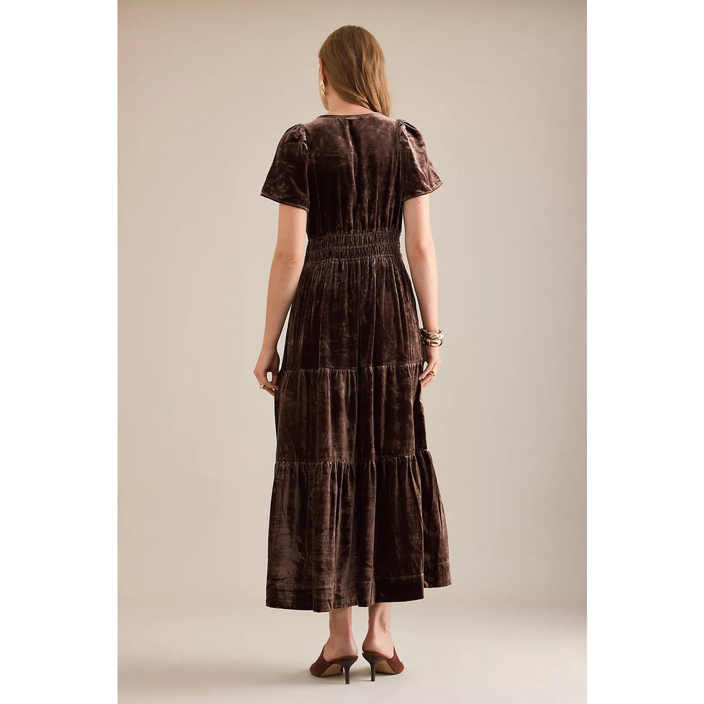 Rear view of chocolate velvet maxi dress with tiered layers and short sleeves