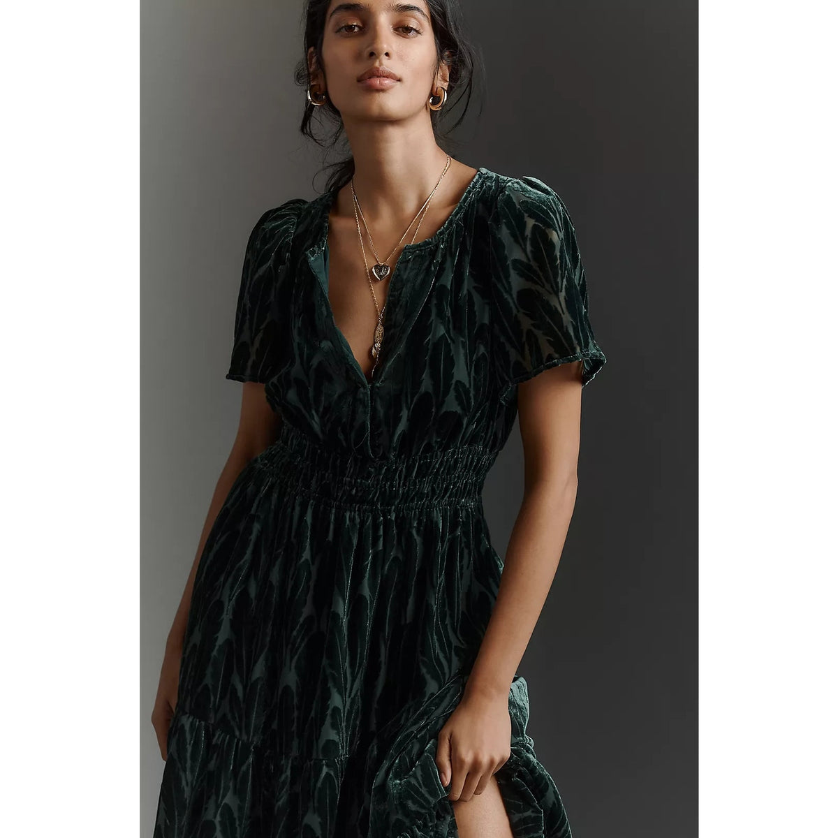 Dark teal velvet maxi dress with V-neck, short sleeves, and tiered gathered skirt