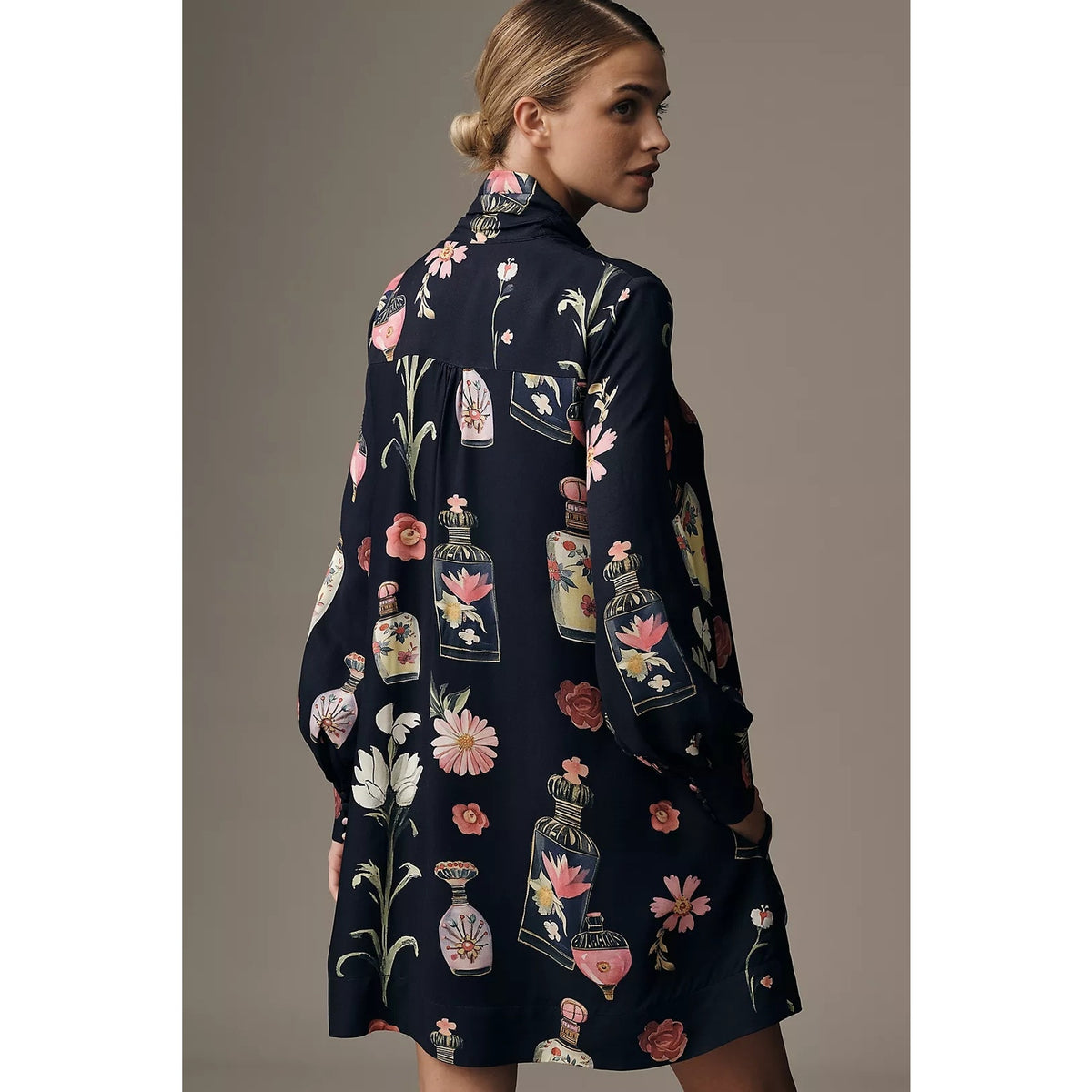 Navy floral long-sleeve mini dress shown from side/back view