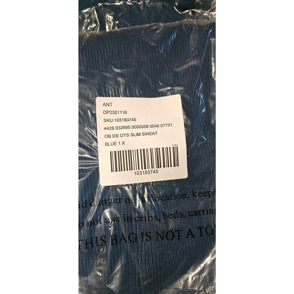 Blue sweater dress garment label in plastic bag with barcode