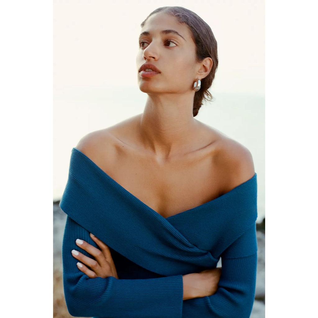 Medium blue off-shoulder sweater dress with long sleeves, fitted bodice, ribbed knit