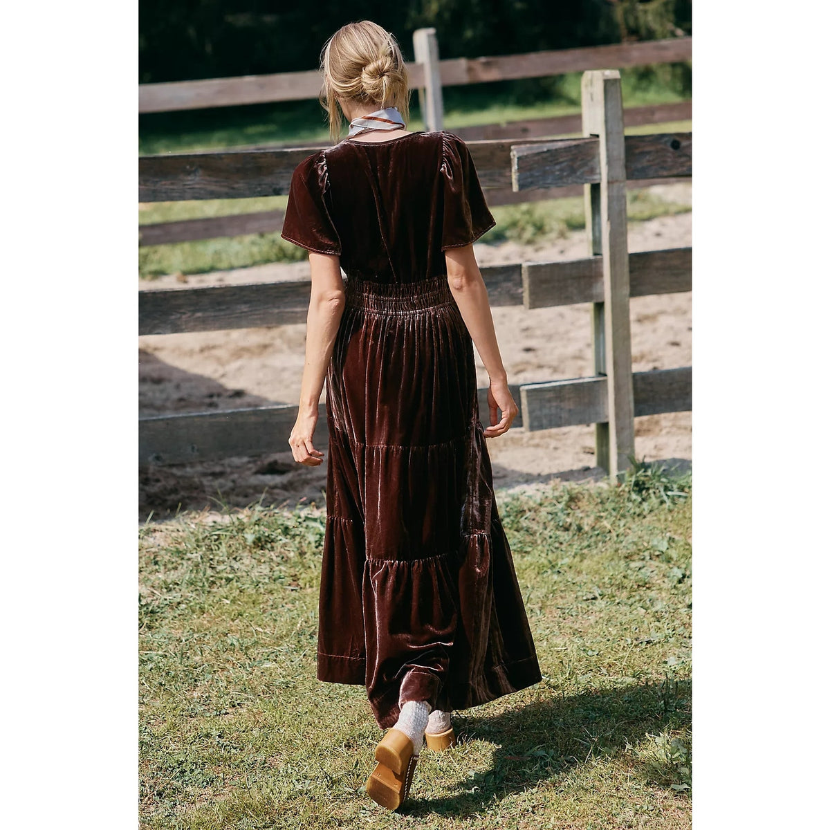 Back view of chocolate velvet maxi dress with tiered skirt and short sleeves