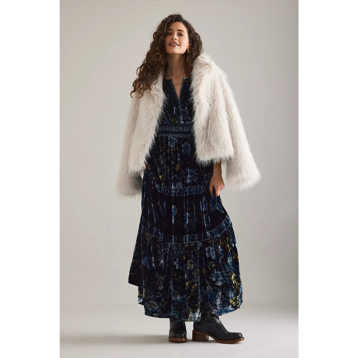 Dark blue velvet maxi dress with V-neck, short sleeves, and tiered ruffle skirt