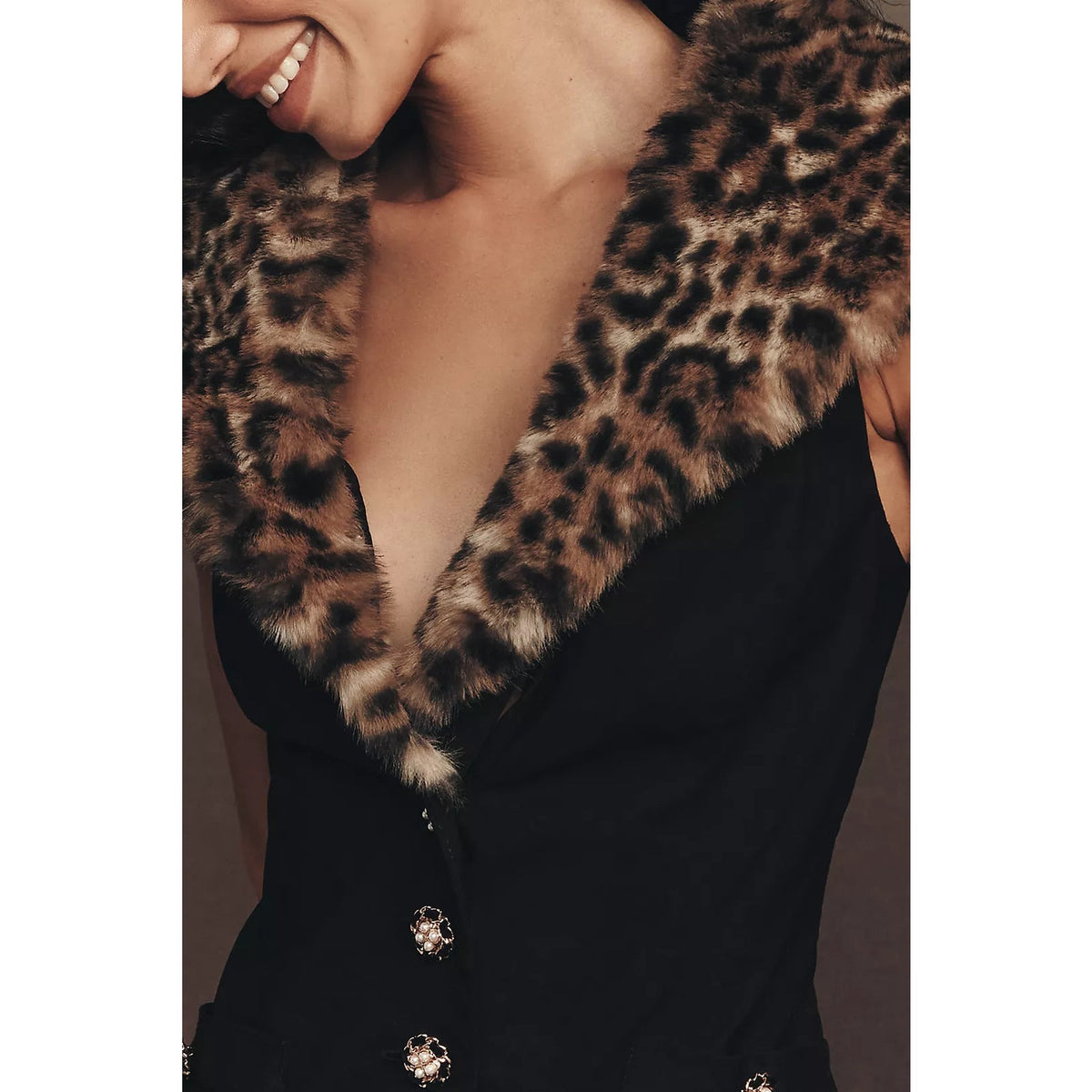 Black mini dress with faux fur leopard V-neck collar and gold button details