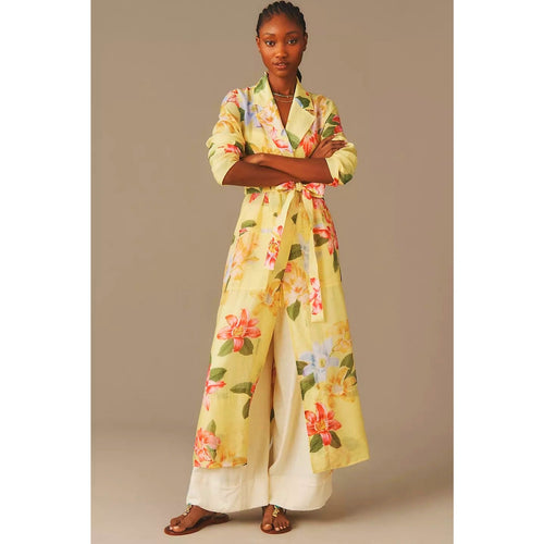 Sheer yellow trench coat with floral print, tie waist belt and button-front