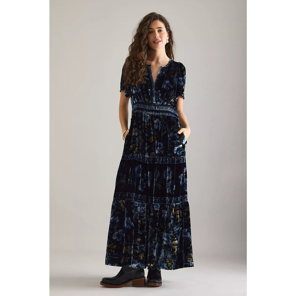Dark blue velvet maxi dress with V-neck, short sleeves, and tiered patchwork skirt
