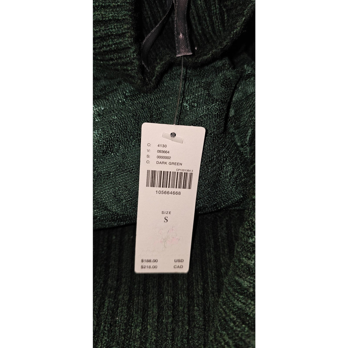 Dark green dress fabric and attached size S tag