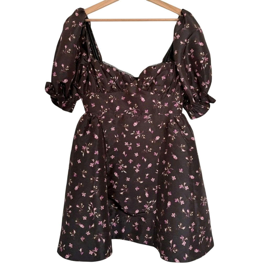 Floral mini dress on hanger with gathered square neckline and puff sleeves