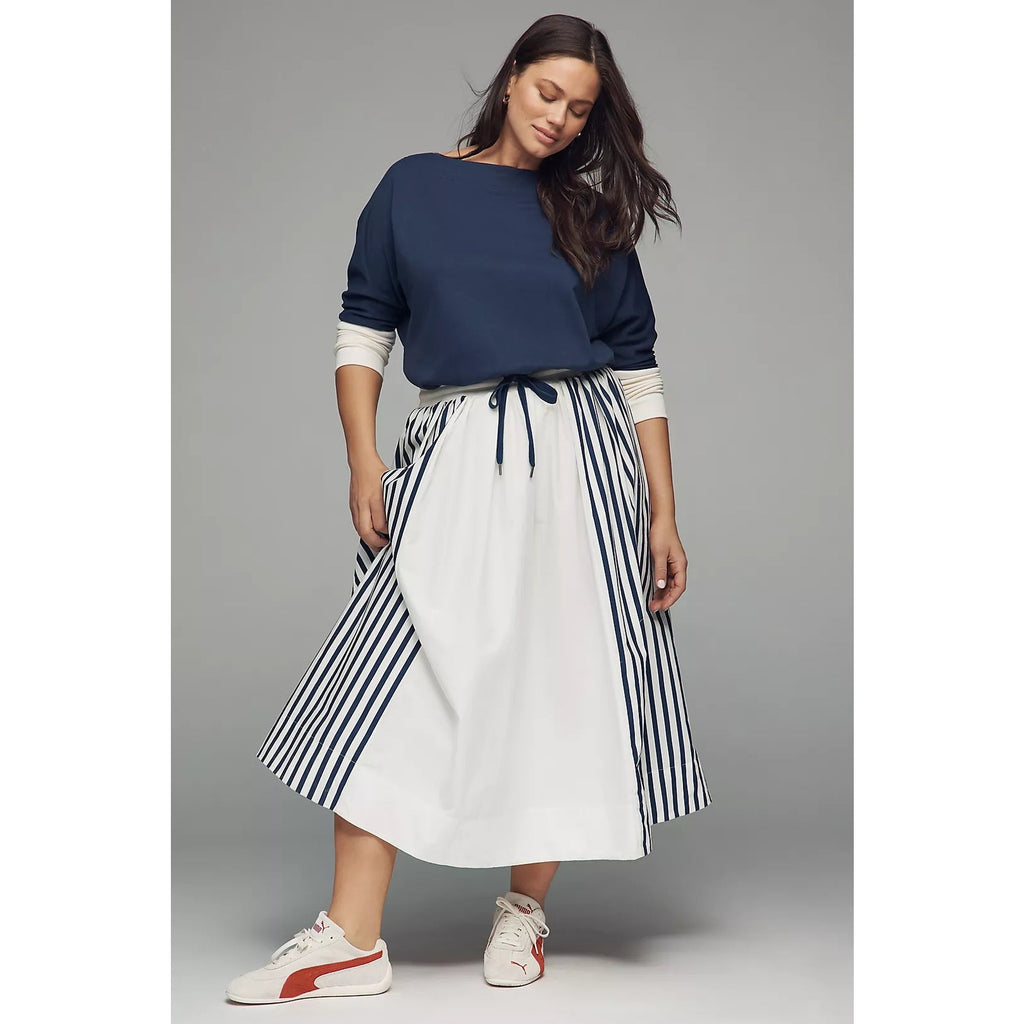Navy and white maxi dress with long sleeves, drawstring waist, and striped skirt