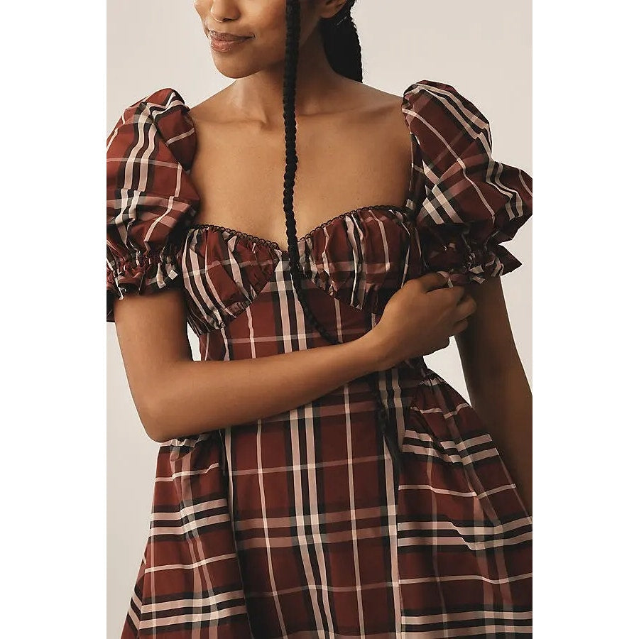 Plaid mini dress close-up: puff sleeves, square neckline, gathered bust in red check