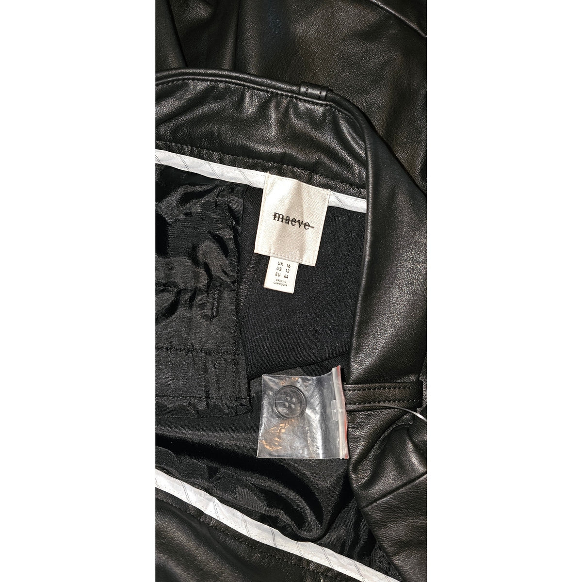 Faux leather shorts interior label and tag with stitched waistband seam