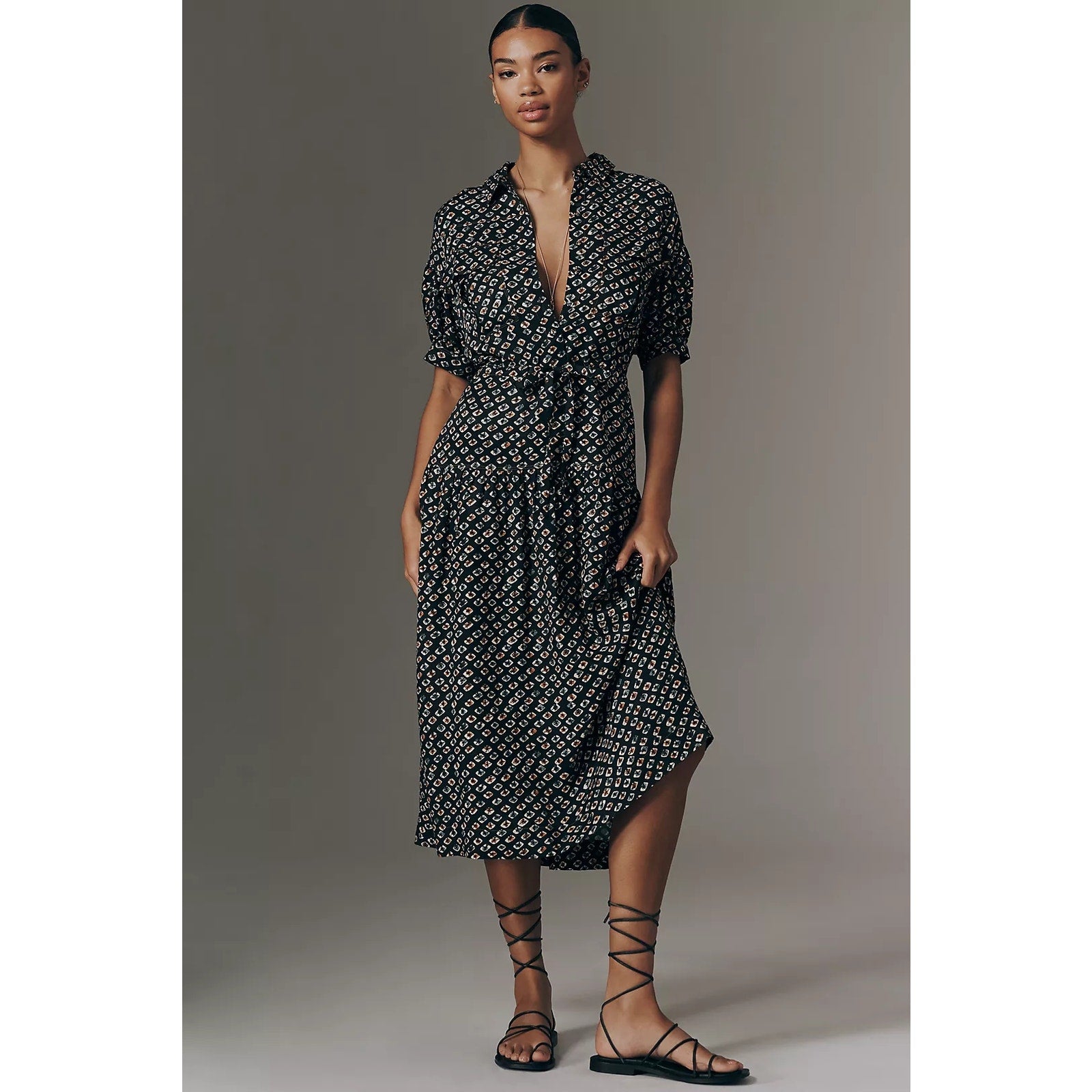 Black printed utility pocket shirtdress with deep V-neck and puff sleeves