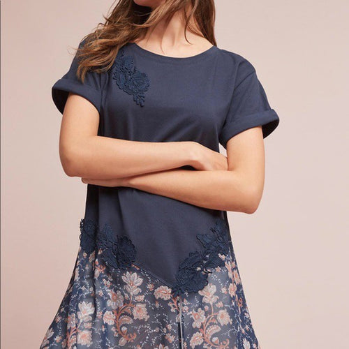 Navy lace tunic top with floral applique at front and sheer printed hem