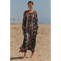 Black long-sleeve tie-front maxi dress with colorful folk pattern and puffed sleeves