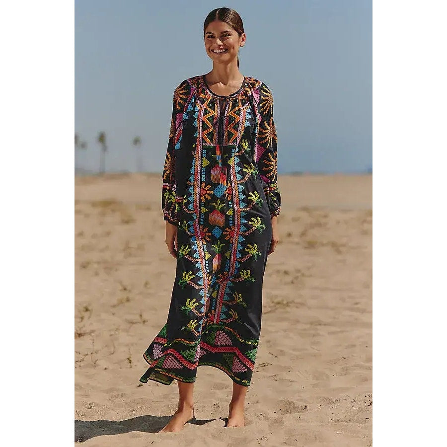 Black long-sleeve tie-front maxi dress with colorful folk pattern and puffed sleeves
