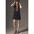 Black sleeveless mini dress with gold keyhole cutout and embroidered details