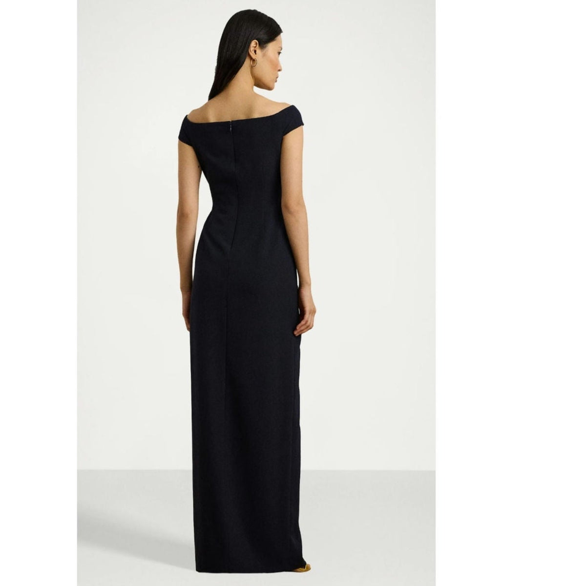 Navy off-shoulder gown side back view with smooth column skirt and draped waist