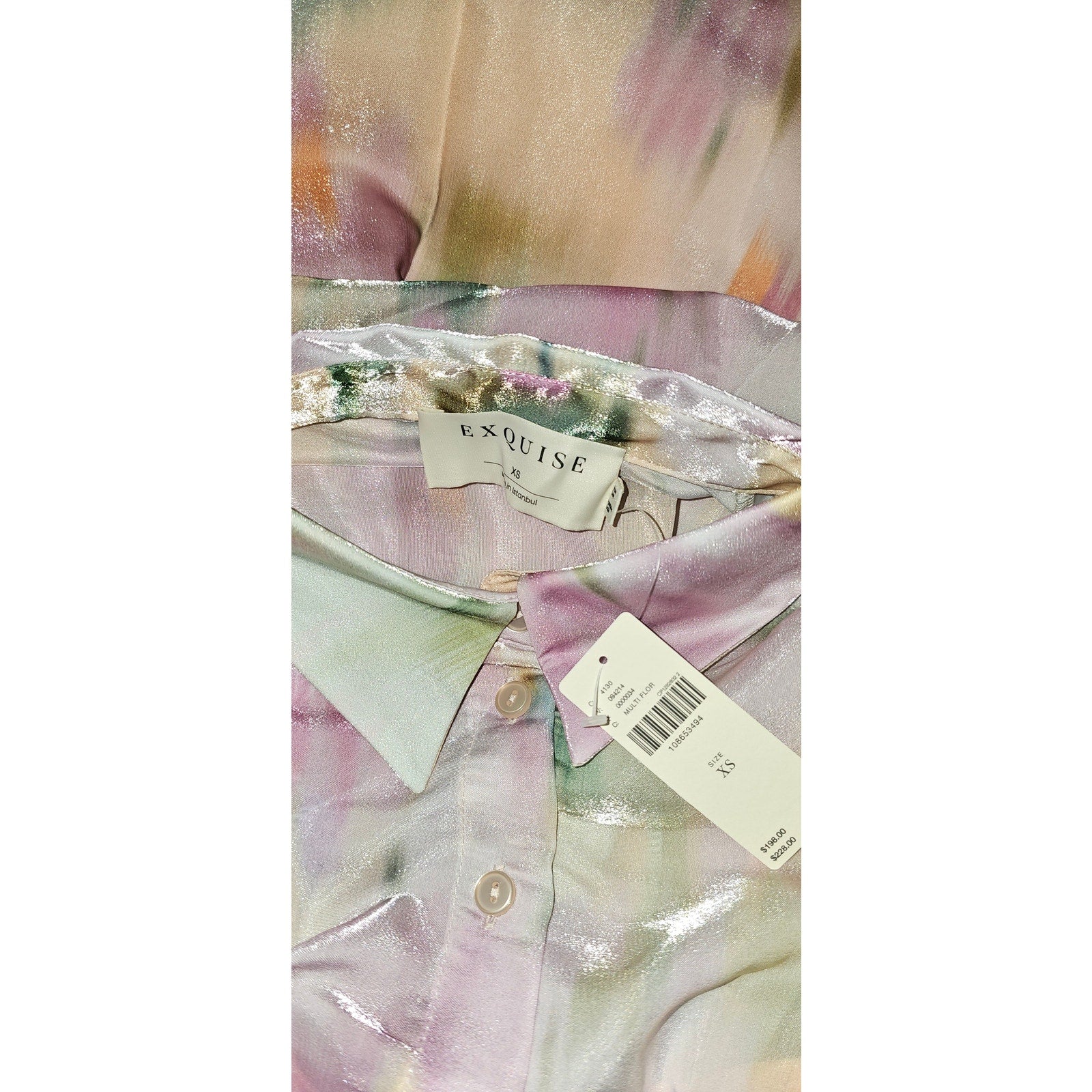 Organza mini shirt dress interior label and size tag on fabric