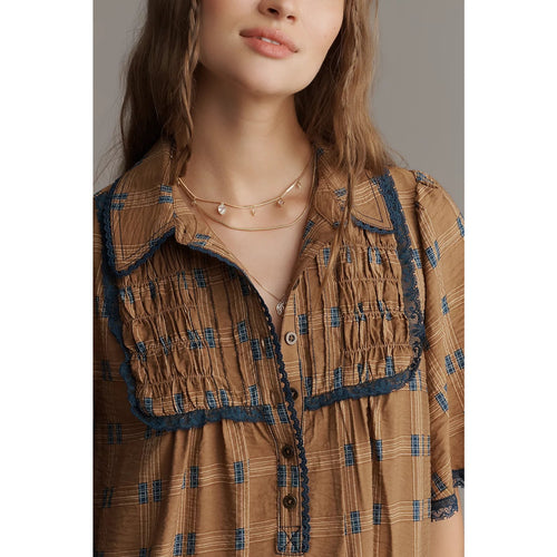 Brown tunic shirt dress top with blue-trim collar, button placket, and patterned yoke
