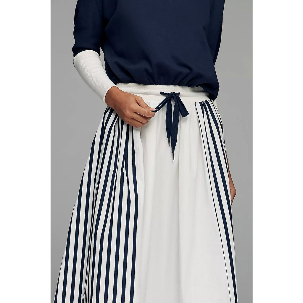 Maxi dress close-up: navy top, white skirt with navy vertical stripes, drawstring tie