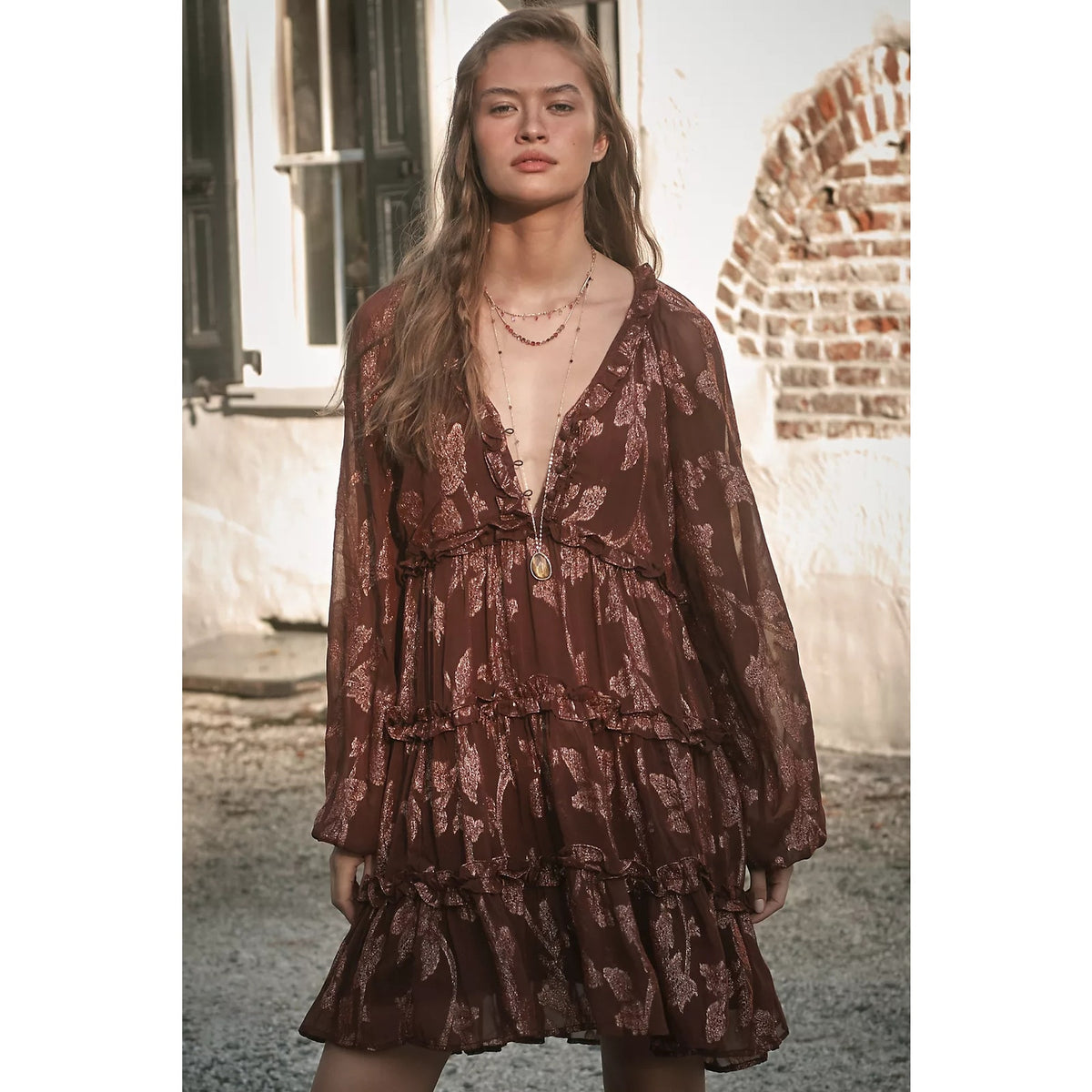 Long-sleeve tiered metallic mini dress in dark plum-brown, V-neck with ruffled tiers