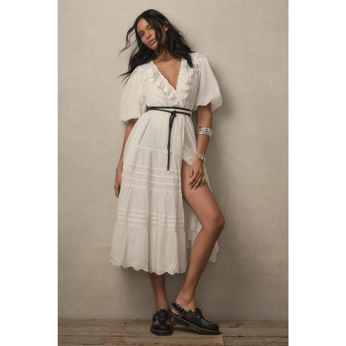 Off-white wrap maxi dress with ruffled V-neck, puff sleeves, and tiered skirt
