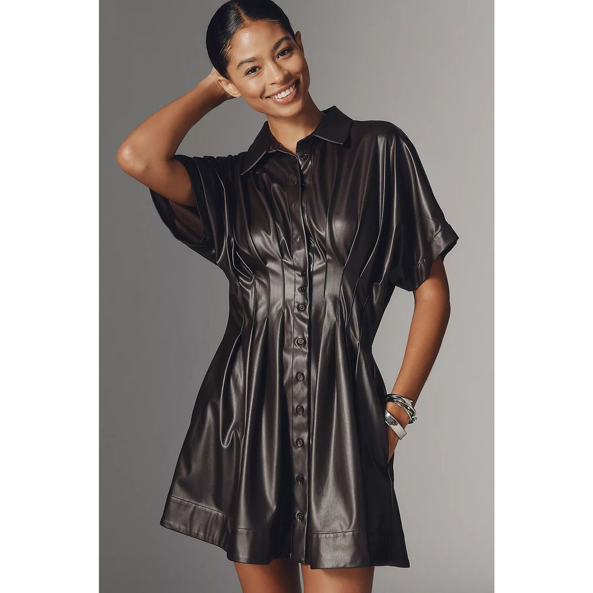 Faux leather mini shirt dress in dark metallic sheen, button-up front and short sleeves