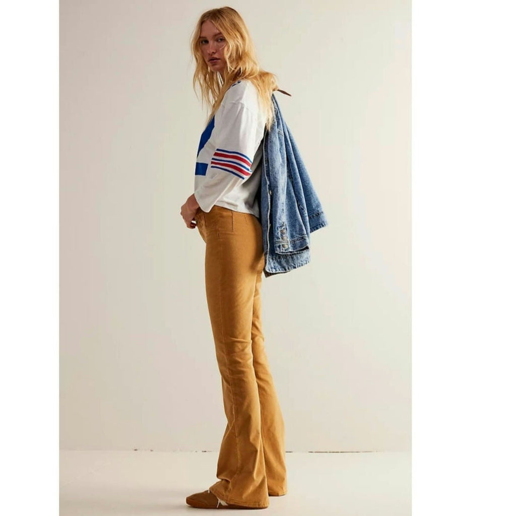 Mustard cord flare jeans with wide bootcut legs and front pockets