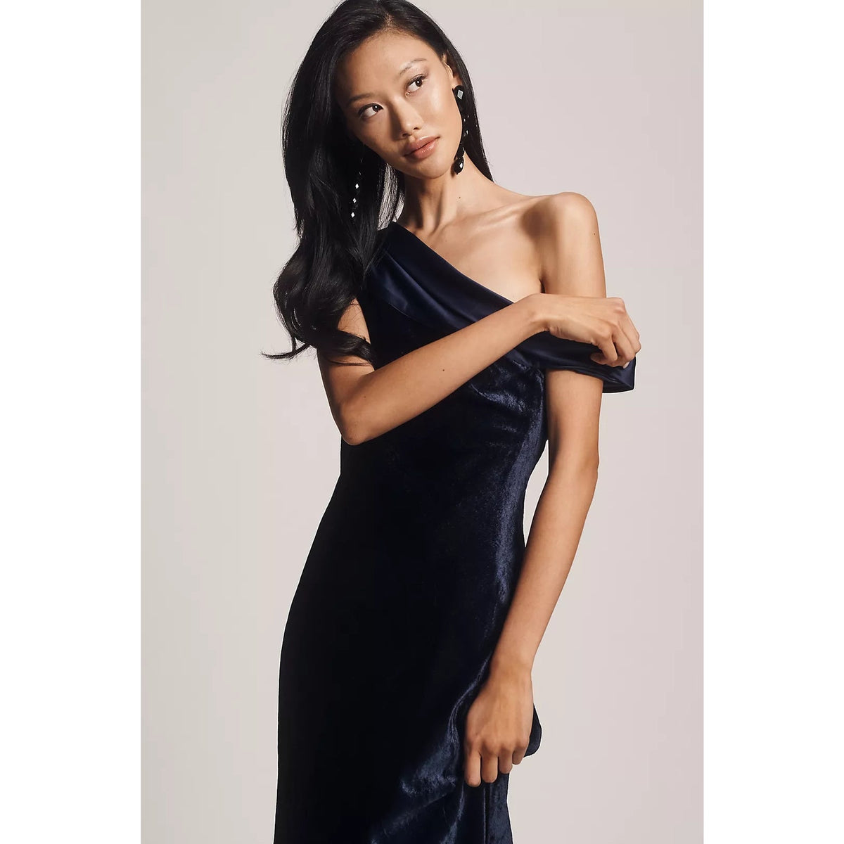 Navy velvet off-shoulder maxi dress with asymmetrical neckline and sleeveless fit