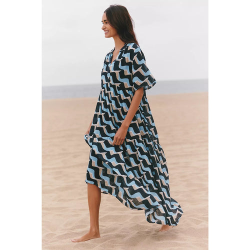 Flowy maxi dress with blue, black, and white zigzag print, short sleeves, V-neck