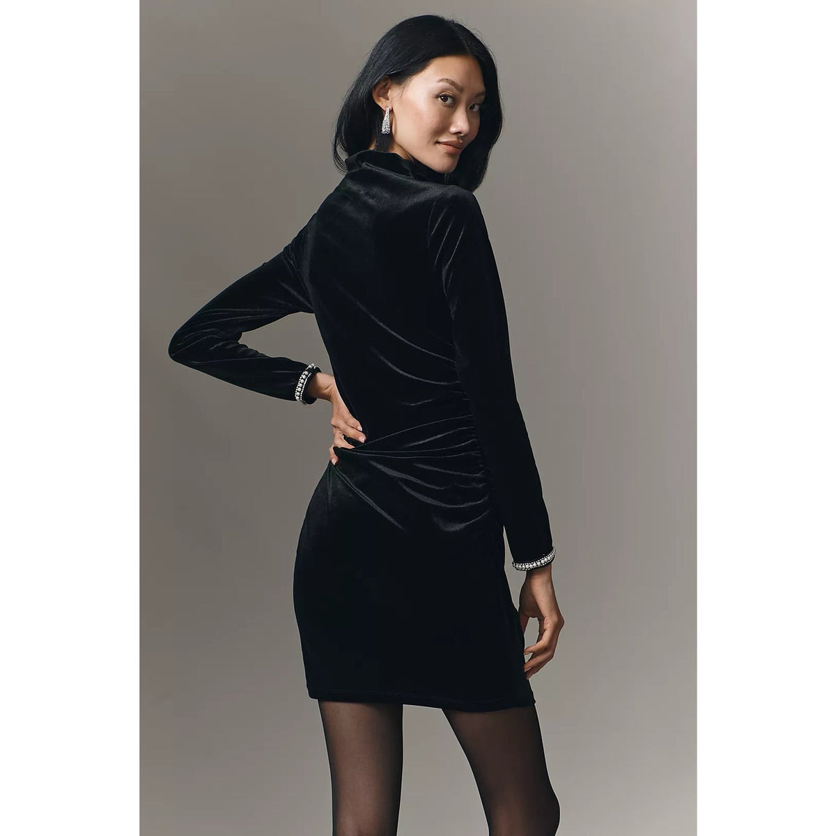 Black ruched cowl-neck mini dress, long sleeves, shiny fabric and rhinestone cuff trim
